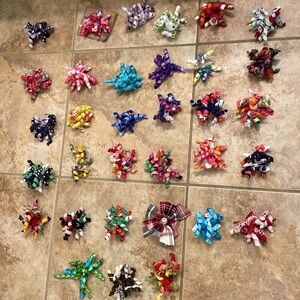 33 sets of Gymboree hair clips/sets.  32  curly set and 1 bow set. EUC